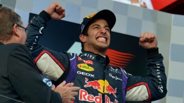 Daniel Ricciardo celebrates on the podium before being disqualified from the Australian Grand Prix.