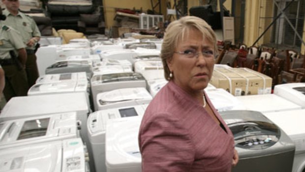 Coming clean...MIchelle Bachelet at police headquarters in Concepcion with returned white goods.
