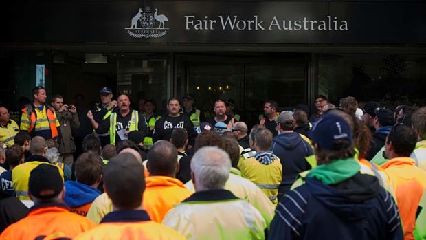 Construction workers at the Wonthaggi desalination plant in Melbourne for the Fair Work Australia ruling on their industrial action. The tribunal  ordered the workers to halt their strike and return to work.
