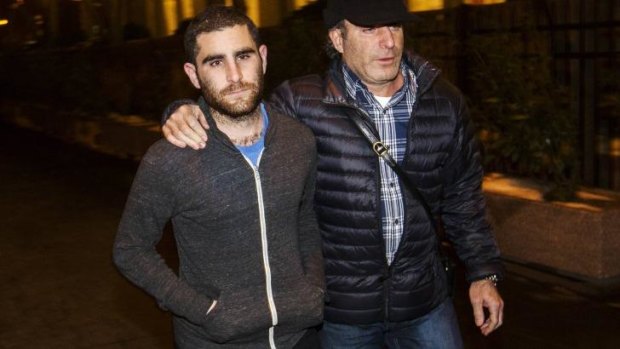 Arrested: Charlie Shrem (left) leaves court in New York after being charged with money laundering.
