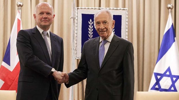 Push for "bold leadership": Britain's Foreign Secretary William Hague shakes hands with Israeli President Shimon Peres.