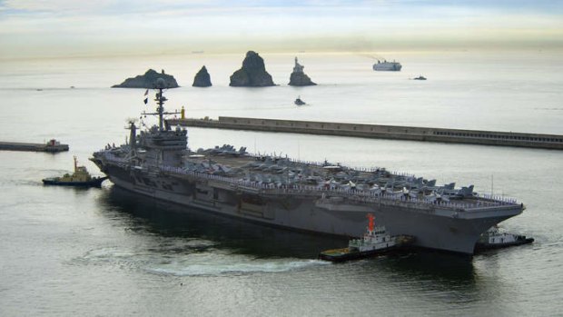 Raising hostilities: The USS George Washington is taking part in naval exercises with South Korea and Japan off the eastern coast of the Korean Peninsula.