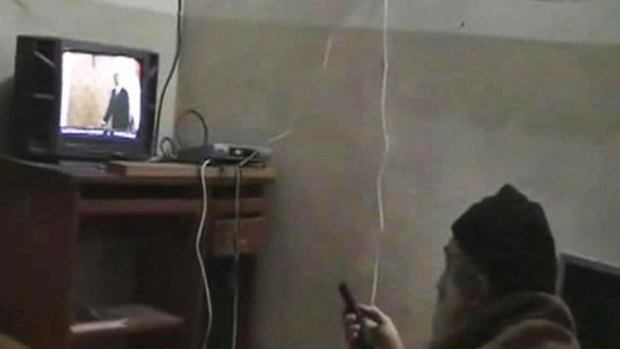 Osama bin Laden watching President Barack Obama on his television.