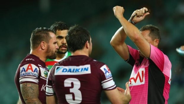 Trouble and strife: Shane Hayne puts Manly’s Anthony Watmough and Jamie Lyon on report.