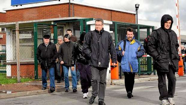 After their three-hour day, the 'so-called' workers leave a tyre factory in northern France.