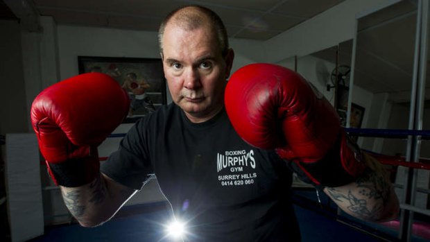 Dukes at the ready, Gerry Murphy teaches boxing to girls.