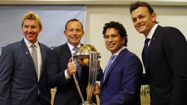 Tony Abbott, second left, holds the ICC World Cup with India's Sachin Tendulkar as they pose with Brett Lee, left and Adam Gilchrist, right in Mumbai, India. The prime minister announced UNINDIAN, starring Brett Lee, will be the first project of the Australia India Film Fund.
