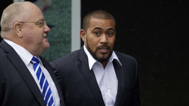 Disappointed &#8230; Bulldogs back-rower Frank Pritchard, right, enters Rugby League Central last night for the judiciary hearing accompanied by Canterbury's manager of football operations Alan Thompson.