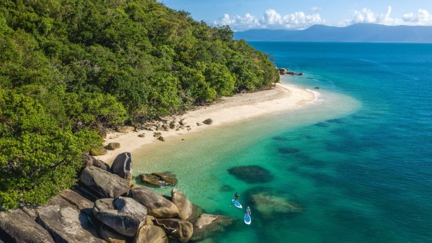 Enjoy stand-up paddle boarding at Fitzroy Island.