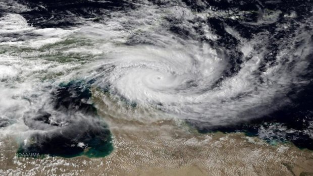Powerful system ... A satellite image of Cyclone Ita hitting far north Queensland. The storm crossed the coast as a category 3 system near near Cape Flattery with destructive winds of up to 230 km/h.
