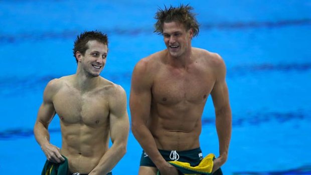 Nick D'Arcy (left) and Kenrick Monk are swimming for Australia, but a history that includes the gun shop pose on Facebook will see the pair fly home early.