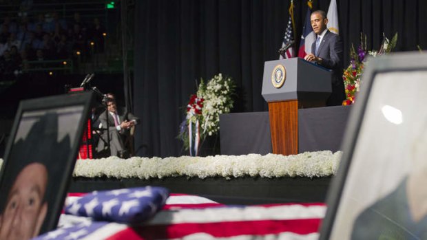 Act of God: Barack Obama speaks at a memorial on Thursday for the 12 firefighters killed in the explosion.