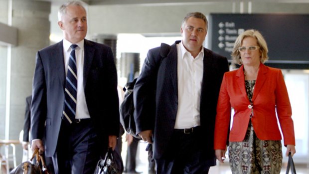 Malcolm Turnbull with wife Lucy Turnbull and Joe Hockey arrive at Sydney airport yesterday.