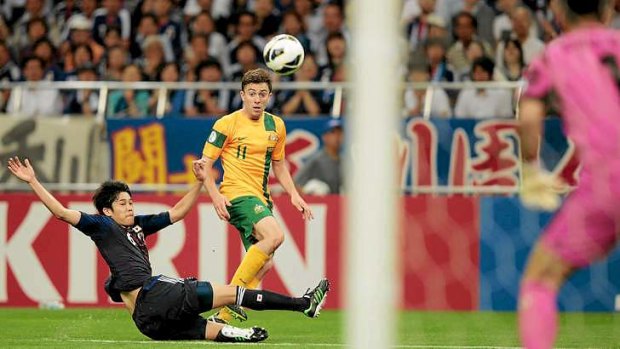 Cross-chip-shot-GOAL! Socceroos winger Tommy Oar watches his cross sail goalwards for his debut strike for Australia in the thrilling 1-1 draw against Japan in Saitama.