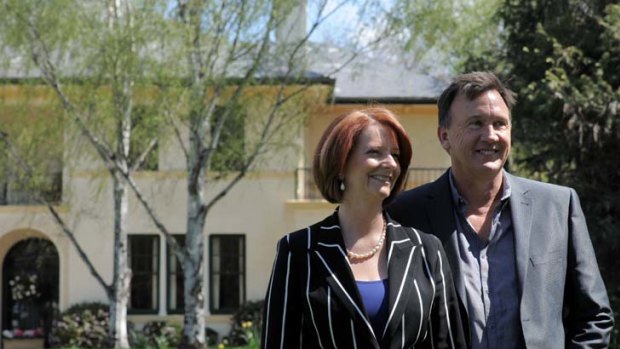 Moving on out ... Prime Minister Julia Gillard and her partner Tim Mathieson outside The Lodge.