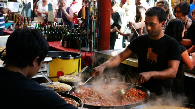 Sate your hunger for late-night shopping, or paella, at the Suzuki Night Market.