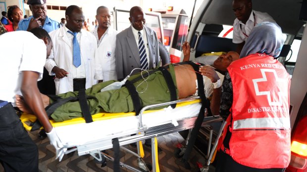 Medics help an injured person at Kenyatta national Hospital in Nairobi, Kenya, after an attack by gunmen at Garissa University College.