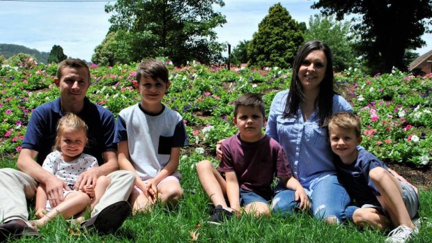 Riley (in the maroon shirt) pictured with mum Kayla, dad Stephen, brothers Brayton and Hudson and sister Henley. 