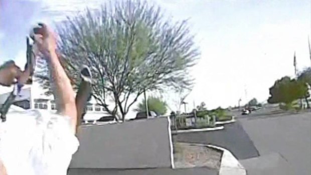 Moment of impract ... In this February 19, frame grab from a dashcam video provided by the Marana Police Department, a police vehicle hits Mario Valencia, sending him flying in the air before the car smashes into a wall. Valencia survived the crash, and prosecutors cleared the officer of any wrongdoing. 