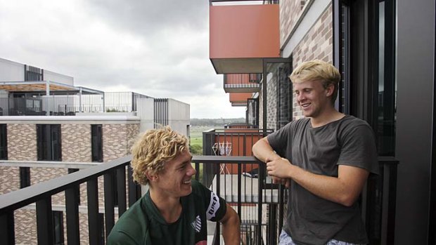 Too good to leave: Ned Hanigan, left, and Andrew Deegan on the balcony of their new student accommodation at the University of NSW in Kensington.
