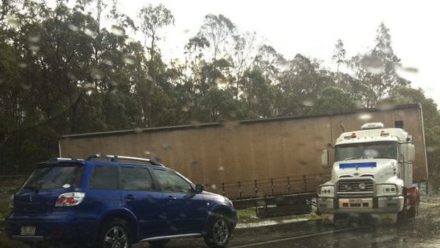 A truck that jack-knifed on the Logan Motorway.