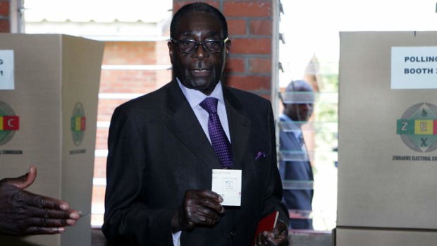 Intimidation fears ... Robert Mugabe  casts his vote  in the referendum on Saturday.
