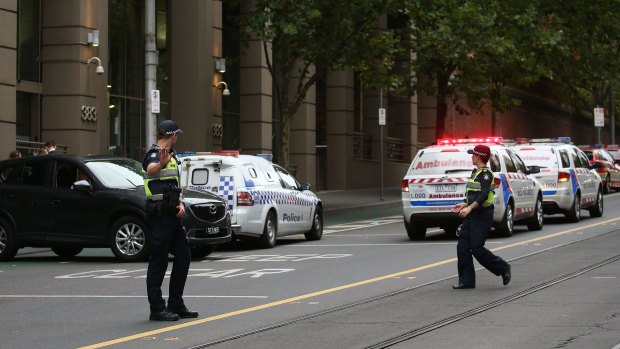 Police at the scene of the shooting, outside the AFP building in Melbourne.