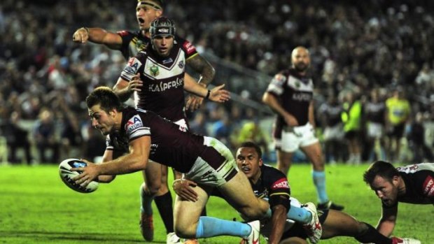 Centre of controversy: Kieran Foran goes over for Manly.