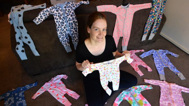 Melbourne collector Sarah with her stash of Bonds wondersuits. 