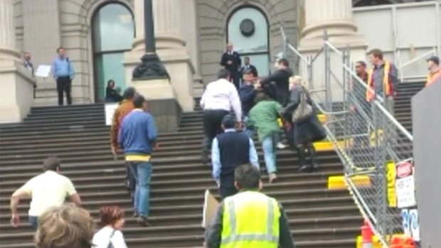 The scuffle on the steps of Parliament.