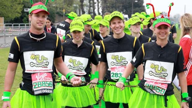 Sam Branson,  Princess Beatrice, Dave Clark and Holly Branson  prepare to take part in the   London Marathon in a 34-person human caterpillar.