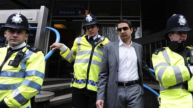 Sporting agent Mazhar Majeed (second right) leaves Westminster Magistrates court in central London, on March 17.