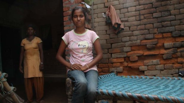 Defiant: Teenager Rakhi ignores the order in her village banning girls and unmarried women having a mobile phone and wearing jeans.