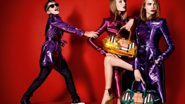 Romeo Beckham pulling off metallics for the latest Burberry campaign, alongside Edie Campbell and Cara Delevigne. <i>Image: Burberry/Mario Testino</i>