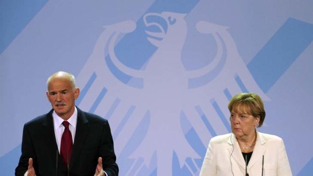 Tough times ... German Chancellor Angela Merkel and Greek Prime Minister George Papandreou.