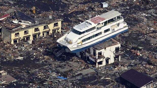 The tsunami dumped this boat on top of a building in a sea of debris in Otsuchi, Iwate prefecture.