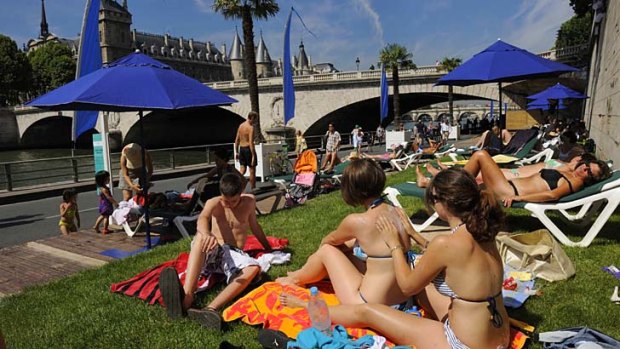 The annual Paris Plage transforms the banks of the Seine River.
