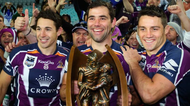 Billy Slater, Cameron Smith and Cooper Cronk after winning the 2012 NRL Grand Final.