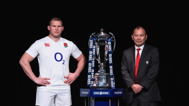No nonsense: Dylan Hartley and Eddie Jones pose with the Six Nations trophy.