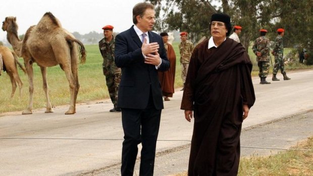 Former British prime minister Tony Blair with Libyan leader Moammar Gaddafi in 2004.