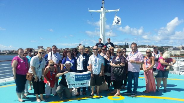 Like-minded travellers: A group of CruiseAholics line up for a group photo.