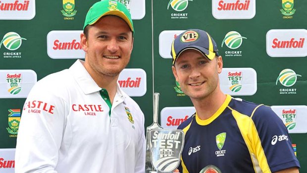 All square: Graeme Smith and Michael Clarke pose with the trophy for the two-match series which was shared after Australia won the second Test.