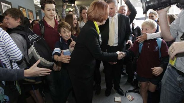 Bun fight: Prime Minister Julia Gillard with the sandwich.