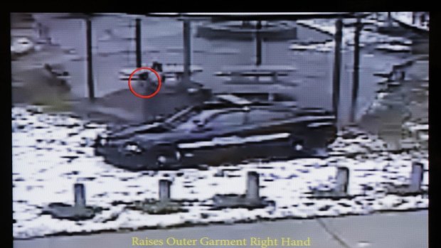 This still image taken from a surveillance video played at a news conference held by Cleveland Police shows police officers arriving at Cudell Park seconds before shooting Tamir Rice.