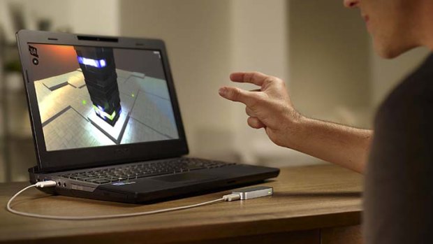 Swipe: A user demonstrates a new motion-control sensor from Leap Motion.