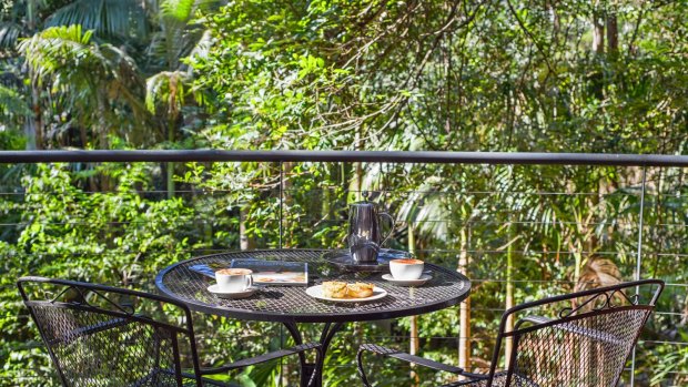 The large timber deck looking over the rainforest is a beautiful setting for some breakfast.