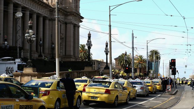 Taxis block the road outside the Victorian Parilaiment.