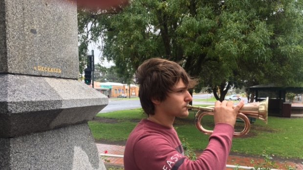 Bullrider Joseph Patterson, 19,  at the Heywood War Memorial obelisk. Patterson travels back to Heywood for Anzac Day each April to play the old bugle.