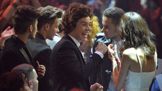 Happiest worst band ever ... Harry Styles (C), Zayn Malik, Liam Payne, Louis Tomlinson, and Niall Horan of British-Irish pop band One Direction celerbate at the BRIT Awards 2013