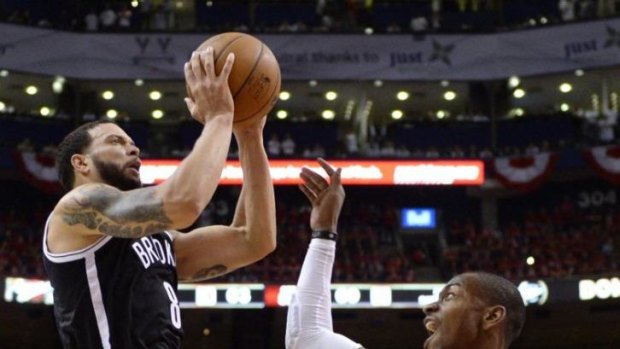Deron Williams drives to the net during Brooklyn's victory
